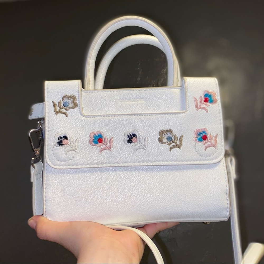 white cross bag or hand bag with embroidered flowers